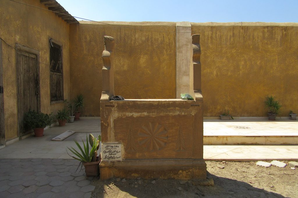 Limestone cenotaph, SW corner of courtyard