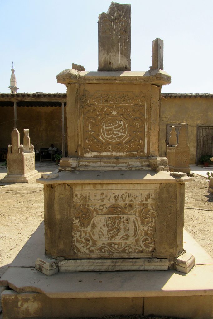 Damaged marble cenotaph, N side