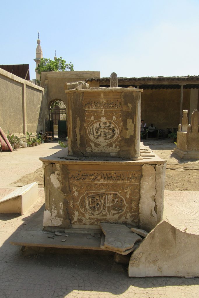 Damaged marble cenotaph, looking S