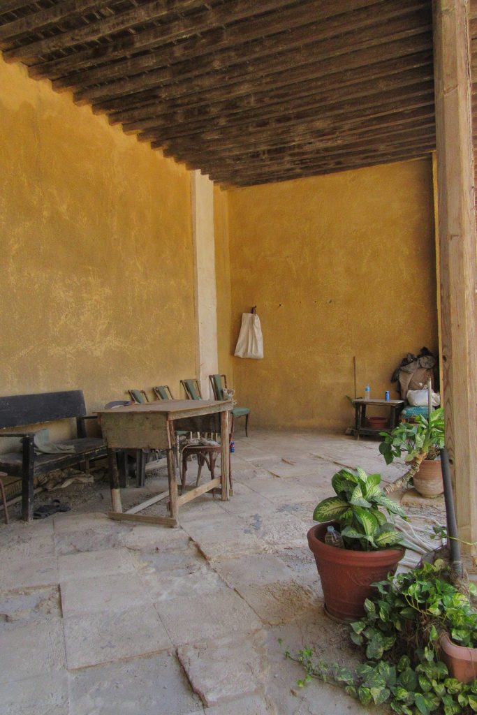 Open-fronted seating area overlooking the courtyard