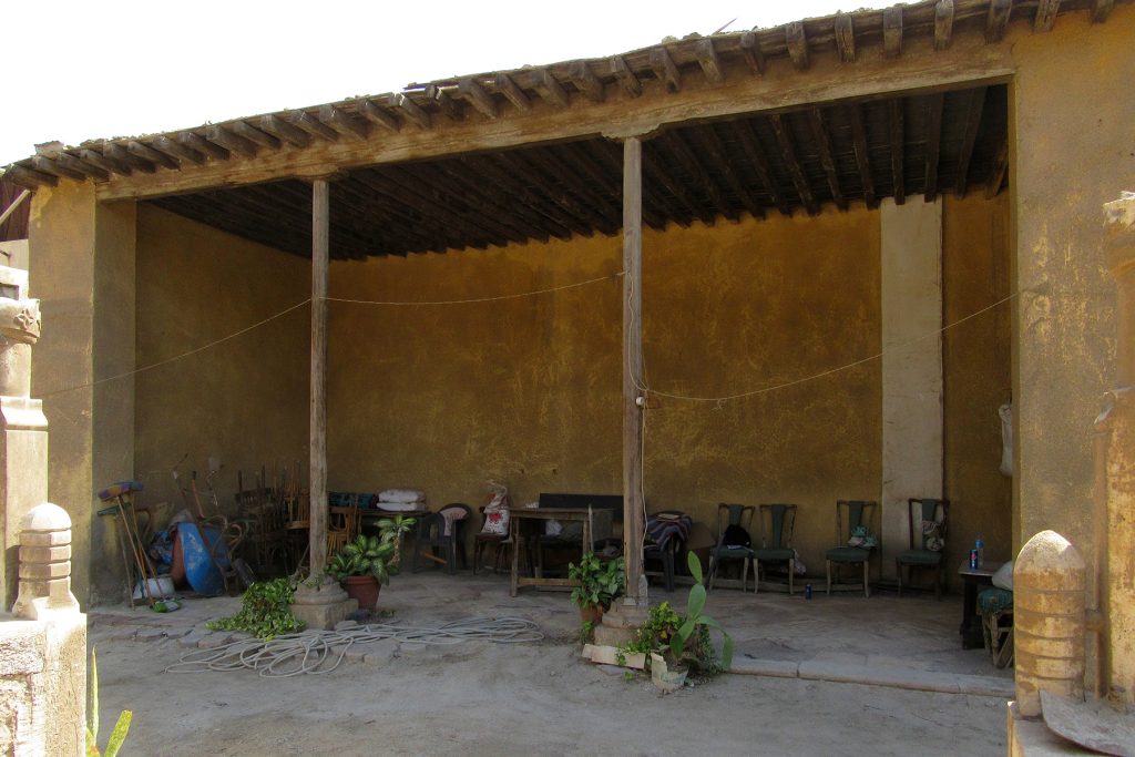 Open-fronted seating area overlooking the courtyard